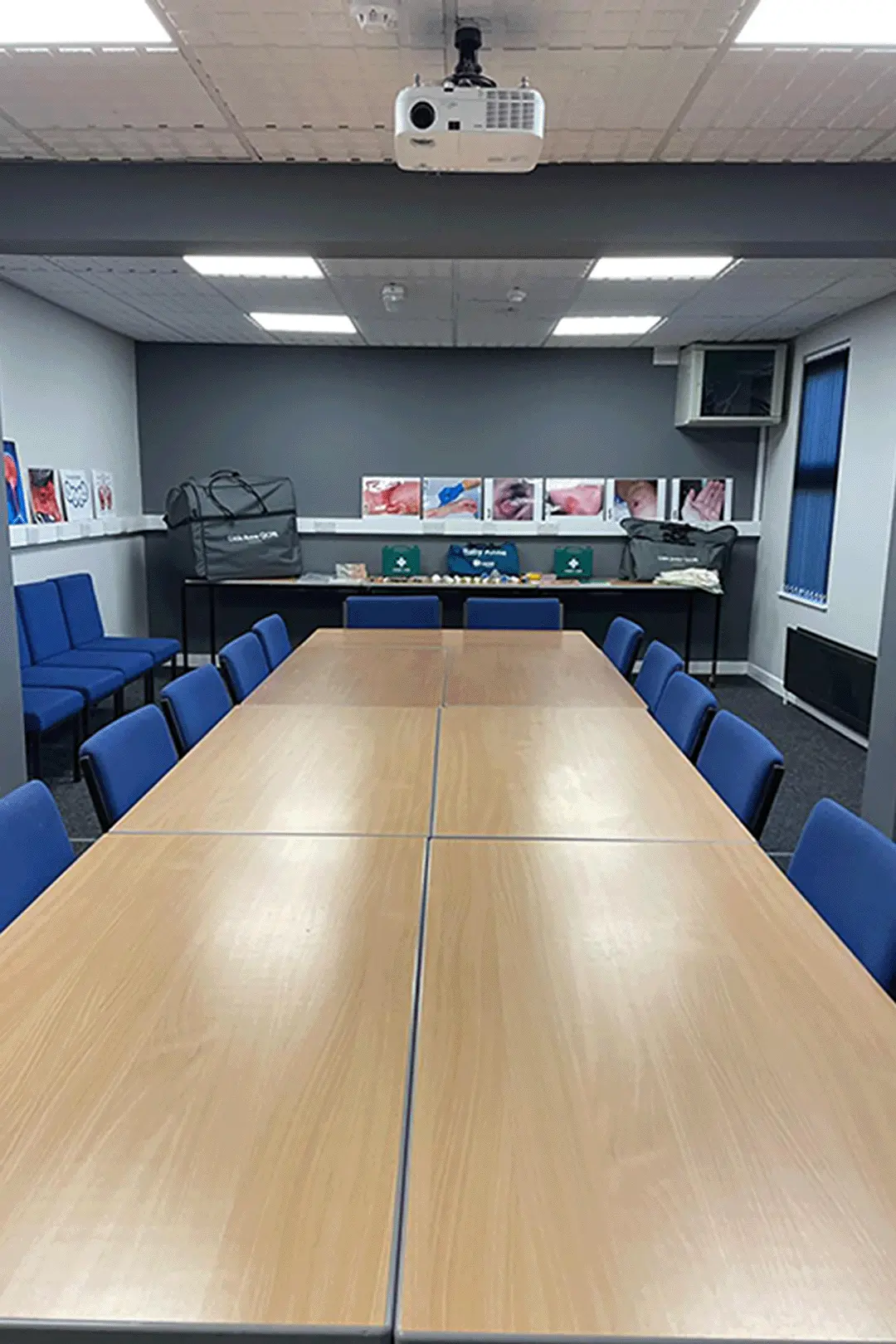 Photo showing long view of the main conference room, showing the display area at one end