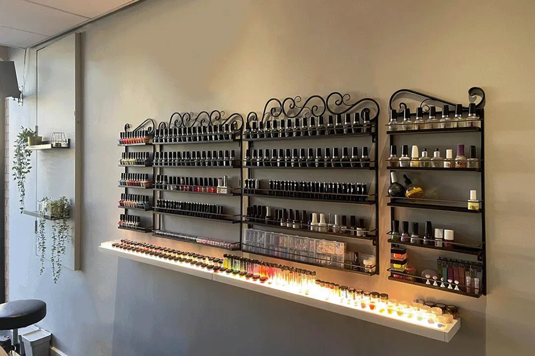 Photo showing wall display with nail polish options